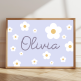 Personalised floral name print with white flowers and pastel purple background – custom girl's wall art.