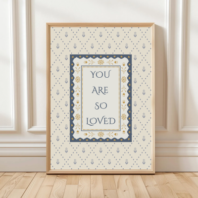 You Are So Loved print with patterned background and double border – available in blue or pink – traditional nursery wall art.