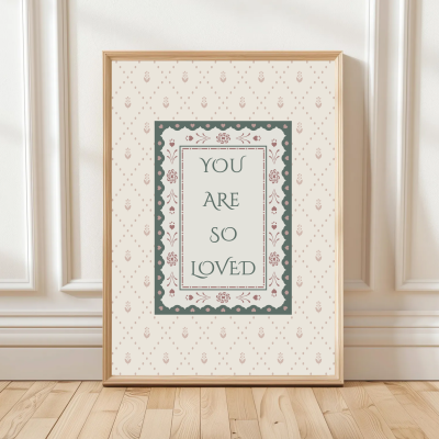 You Are So Loved print with patterned background and double border – available in blue or pink – traditional nursery wall art.